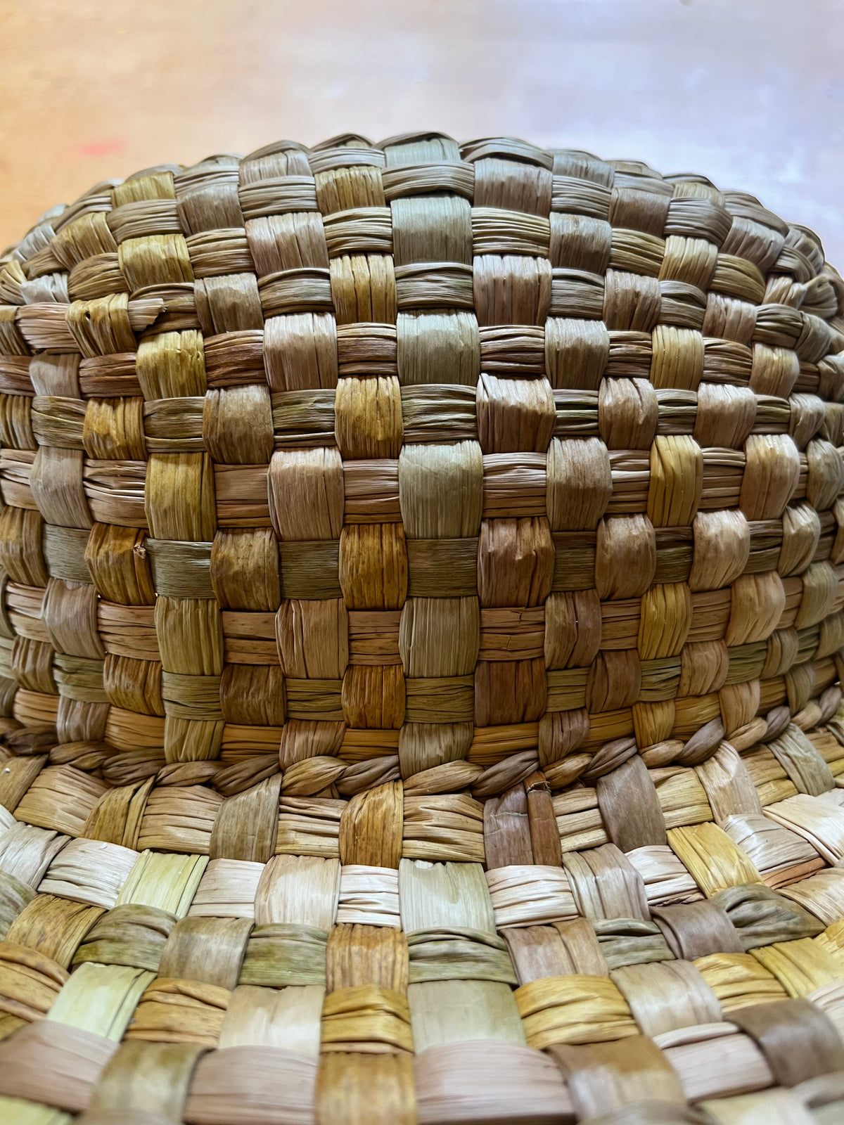 Instructor wearing a hand-woven rush hat