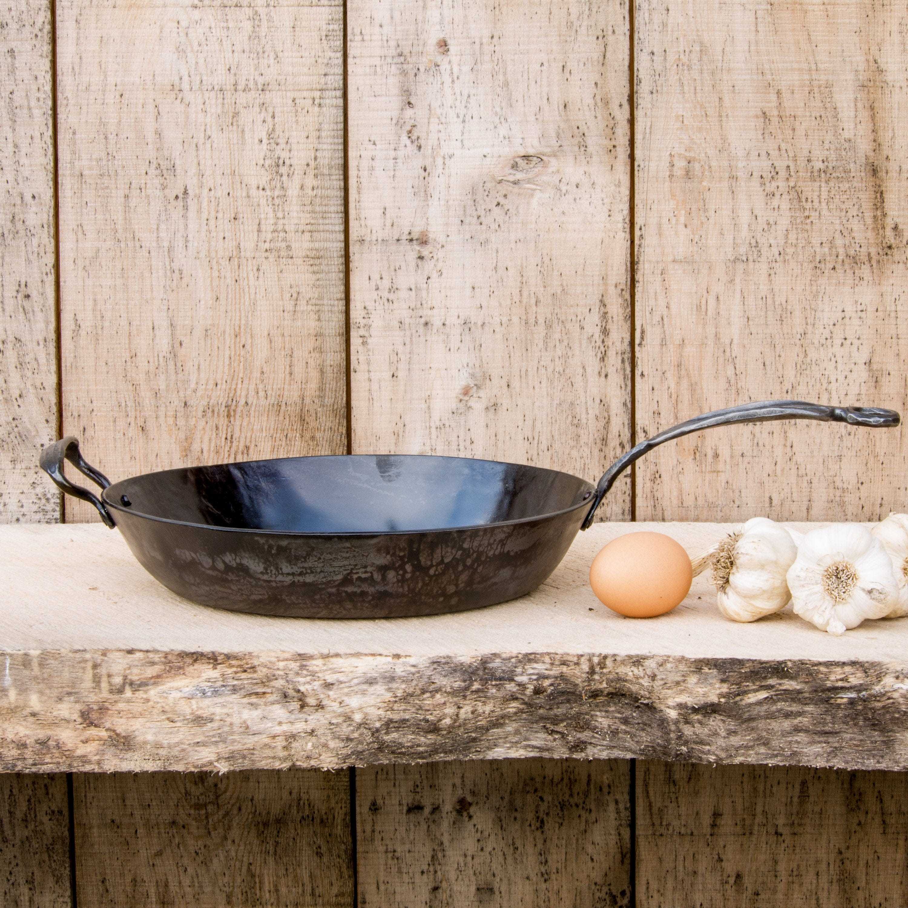 https://www.newquistforge.com/cdn/shop/products/13-carbon-steel-french-skillet-13-carbon-steel-pan-hand-forged-cookware-newquist-forge-newquist-forge-36650185392373.jpg?v=1674684695