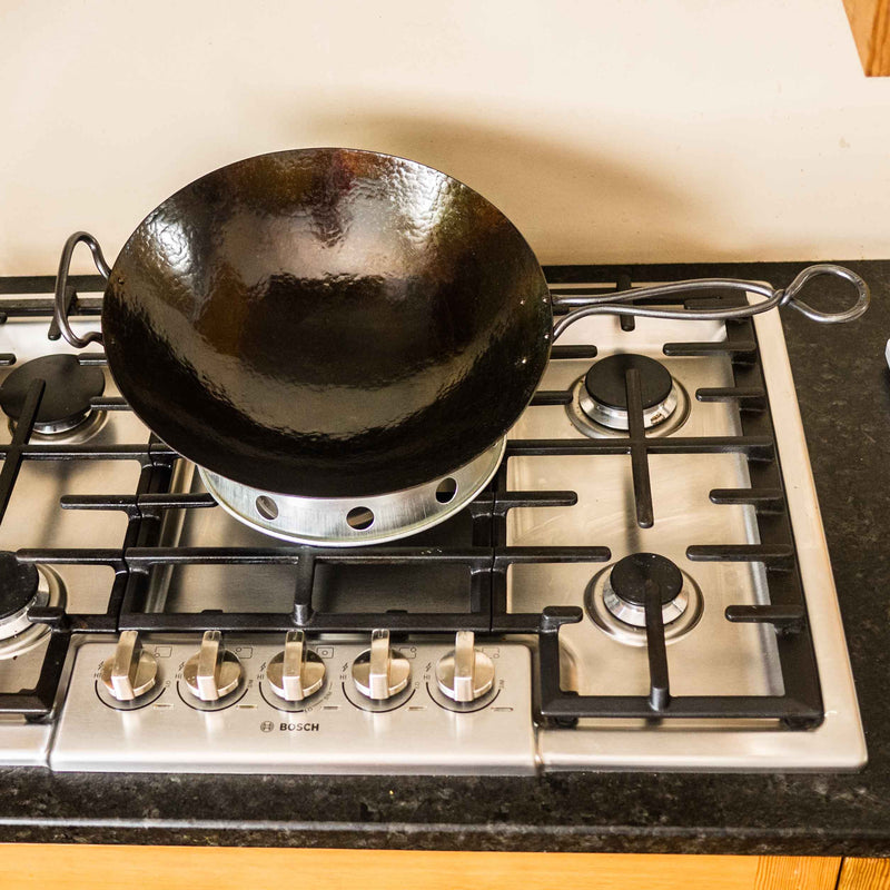 Hand Hammered Classic Wok with a metal handle that stays cool while cooking