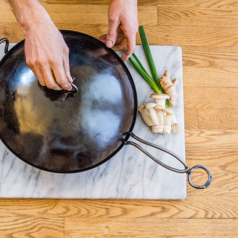 Hand Hammered Classic Wok with a metal handle that stays cool while cooking